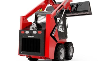 Kleine graafmachine op wielen voor bouw- en tuinprojecten.