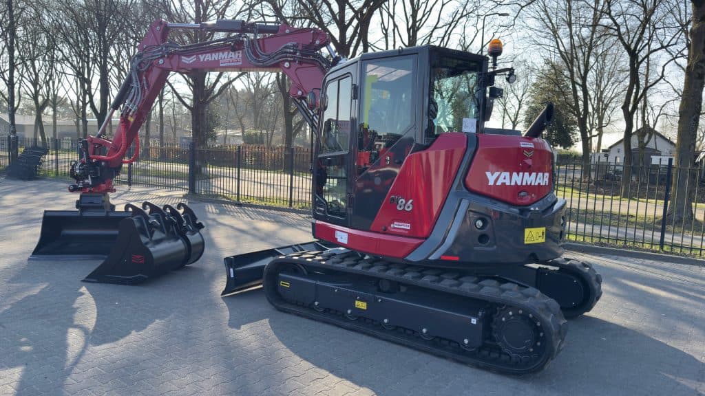 Kleine grijper en mini graafmachine Yanmar SV 08 met cabine, geschikt voor compacte bouw- en tuinwerken.