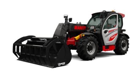 Robuuste Manitou heftruck met cabine en voorlader, geschikt voor agrarisch gebruik.