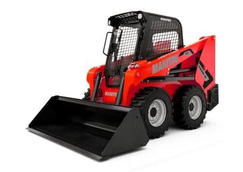 1. Mini shovelmachine van Manitou met cabine en grote banden, geschikt voor bouw en industrie.